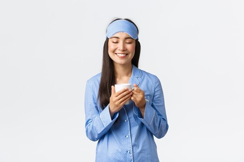 a woman holding a coffee cup