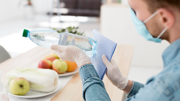 A person cleaning a water bottle